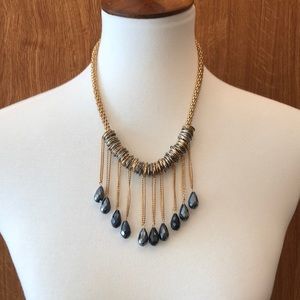 Gold and silver necklace with dark beads